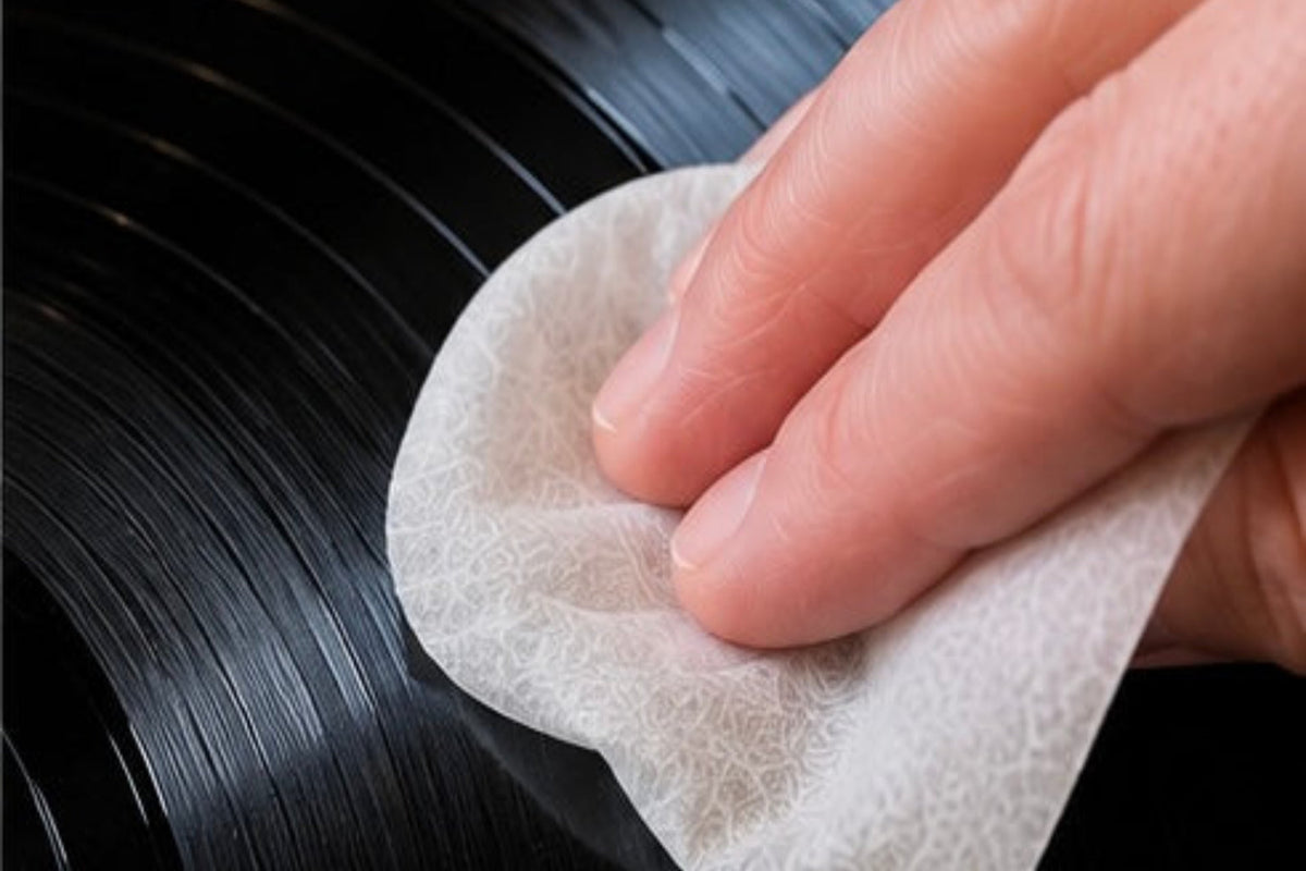 Pre-saturated Record Prep wipe cleaning dust and fingerprints from a vinyl record