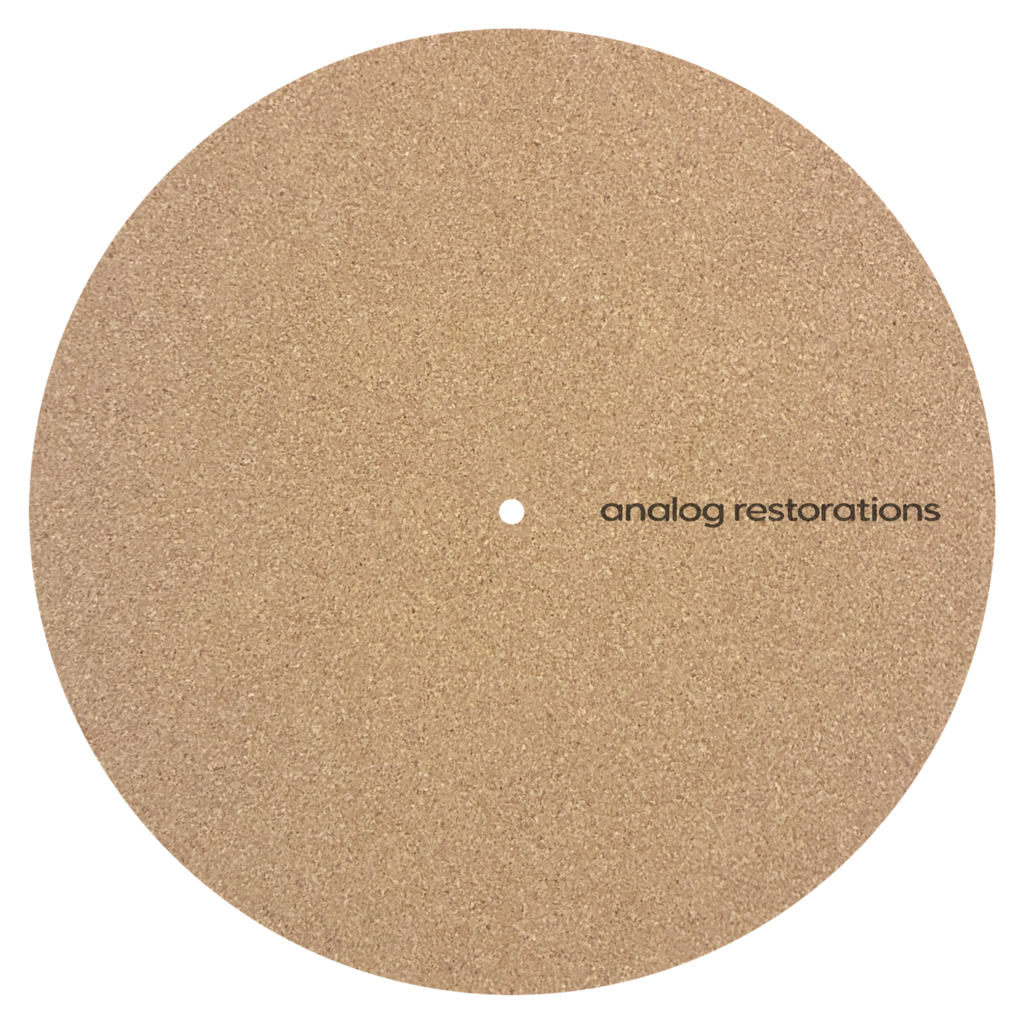 Analog Restorations logo cork turntable platter mat displayed on a turntable